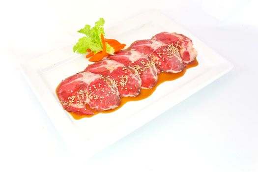 freshness slided pork on white dish for grill
