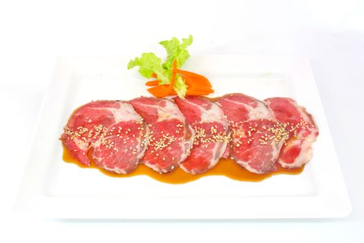 freshness slided pork on white dish for grill