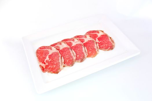 High grade sliced Hida wagyu beef isolated on white background