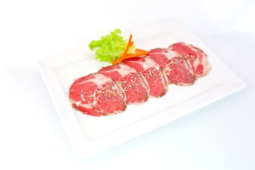 High grade sliced Hida wagyu beef isolated on white background