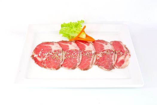 High grade sliced Hida wagyu beef isolated on white background