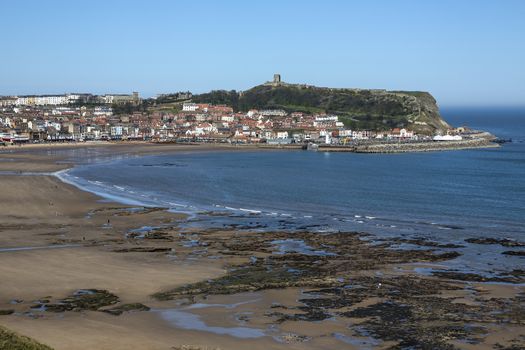 Scarborough Castle on a hillside above the town and harbor - North Yorkshire coast in the northeast of England.