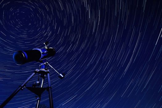 Astronomy - Star Trails in the early Spring sky in North Yorkshire in the United Kingdom. The star trails appear to rotate around Polaris, the Pole Star.