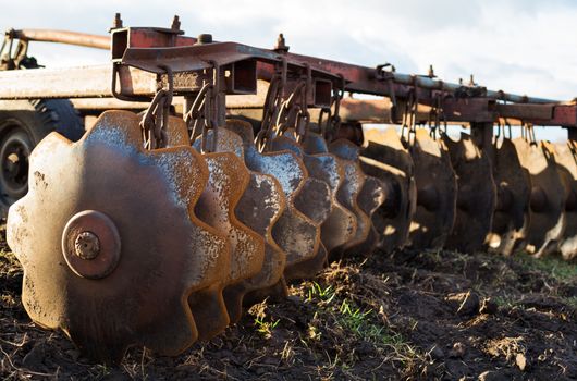 Disc harrow used to cultivate the soil. Close up.