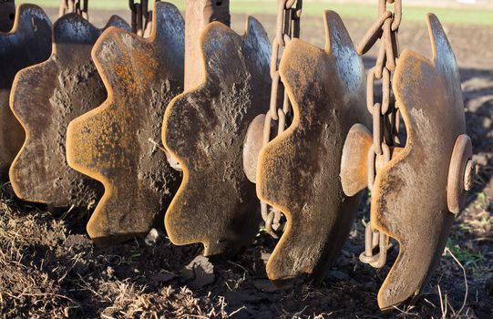 Disc harrow used to cultivate the soil. Close up.