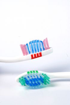 close up  of blue tooth  and green brush, picture of a 