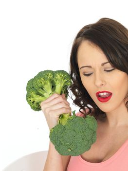 Young Attractive Woman Holding Raw Broccoli
