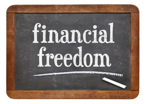 financial freedom - text on a vintage slate blackboard