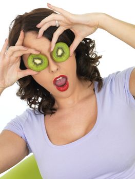 Young Healthy Woman Holding Fresh Ripe Kiwi Fruit