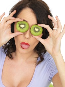 Young Healthy Woman Holding Fresh Ripe Kiwi Fruit