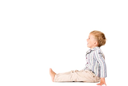 Boy in shirt shot in the studio on a white background