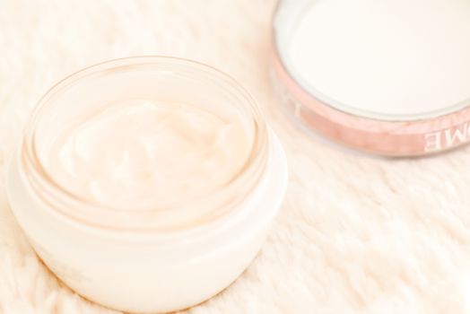 Cosmetic cream in an open jar with shallow depth of field