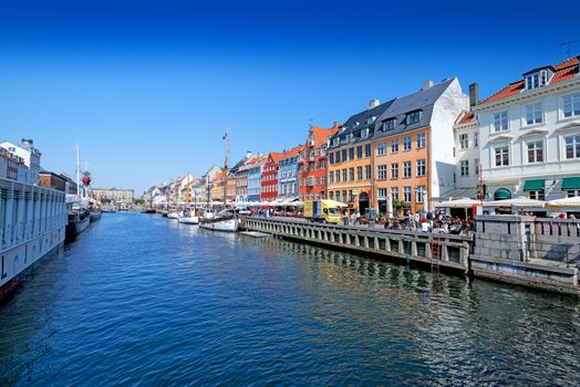 COPENHAGEN, DENMARK - MAY 18: unidentified people in open cafes of the famous Nyhavn promenade on May 18, 2013 in Copenhagen, Denmark. Nyhavn is one of the most famous landmark of Copenhagen.