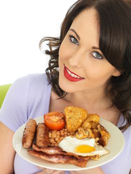 Young Attractive Woman Eating a Full English Breakfast