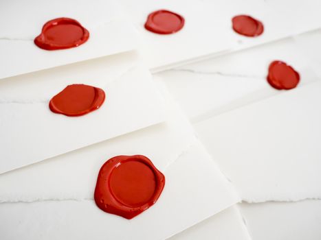 group of white letters closed by red sealing wax