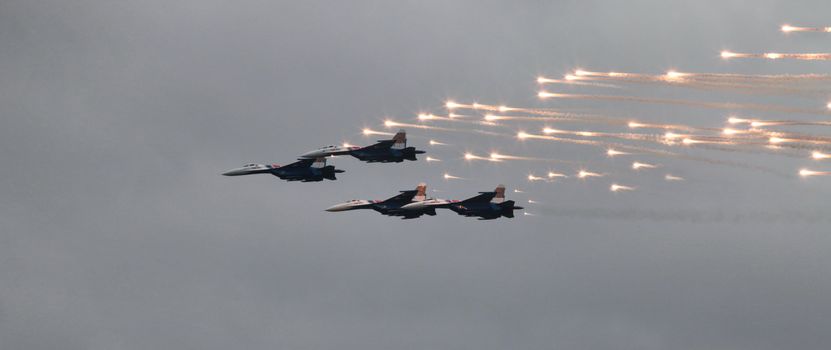 Aerobatic team 'Swifts' on the MiG-29 fighter fires a missile thermal