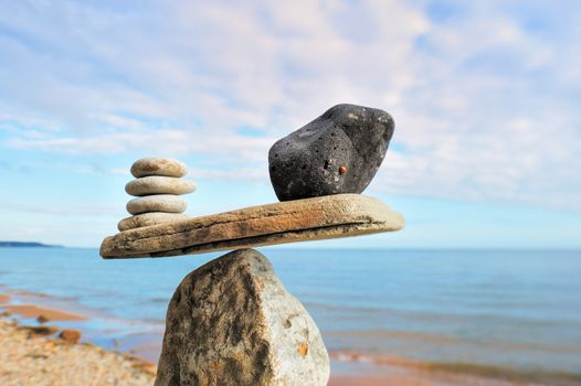 Well-balanced of stones on the top of boulder