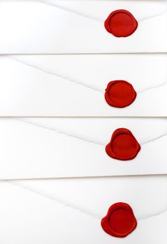 group of white letters closed by red sealing wax