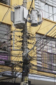 Tangle of Electrical Wires on Power Pole