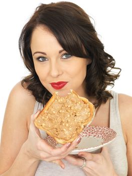 Young Healthy Woman Holding Toast with Crunchy Peanut Butter