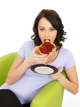 Healthy Young Woman With Strawberry Jam on Toast