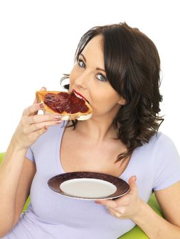 Healthy Young Woman With Strawberry Jam on Toast