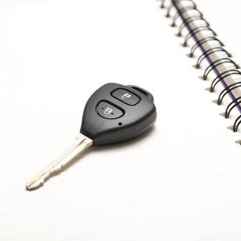 car key on notebook paper