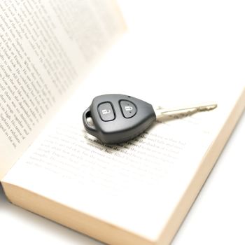 car key with book isolated on white background