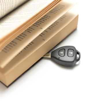 car key with book isolated on white background