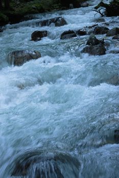 Mountain river run away after the sunset