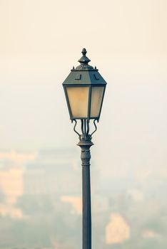 Ornate lamp closup photo outdoors in city