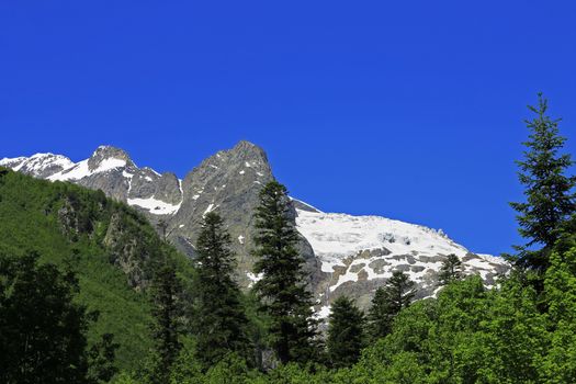 Caucasus Mountains Under Snow And Clear Blue Sky