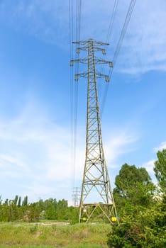 Large electric pylon with blue sky angle shot