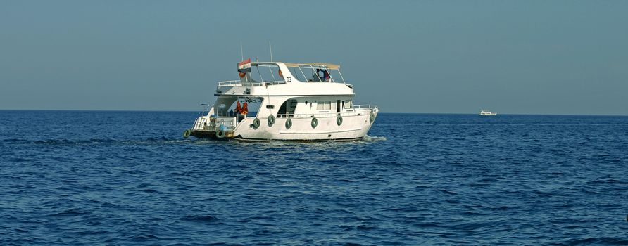 White Ship Moving By The Red Sea