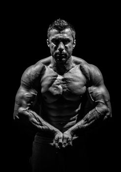 bodybuilder, posing on a black background