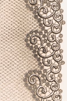 Decorative lace on insolated light background - macro