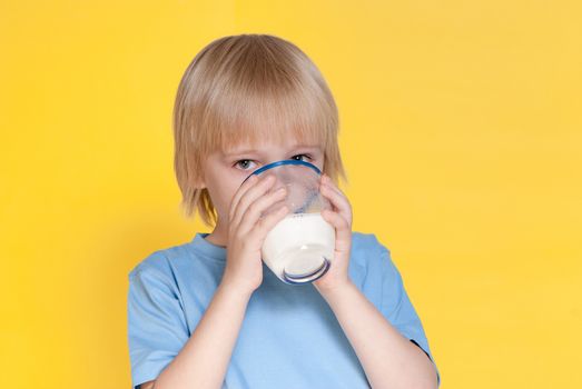 Little boy drinking milk