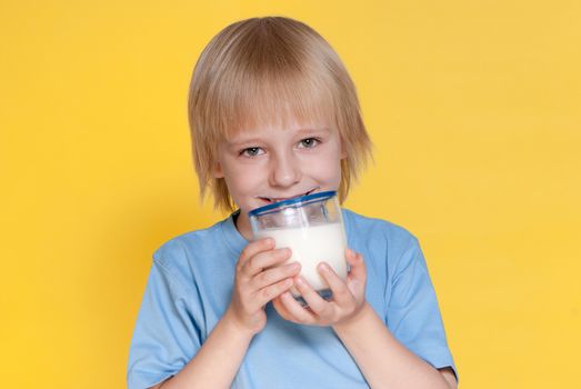 Little boy drinking milk