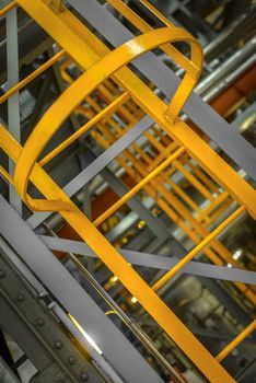 Large yellow ladder in industrial interior Photo