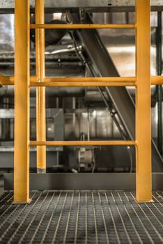 Large yellow ladder in industrial interior Photo