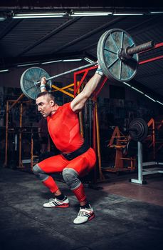 Powerlifter with strong arms lifting weights