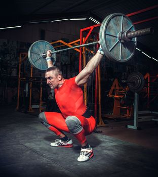 Powerlifter with strong arms lifting weights