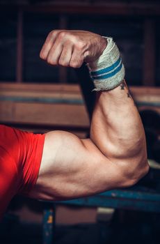 Male bodybuilder flexing his muscles