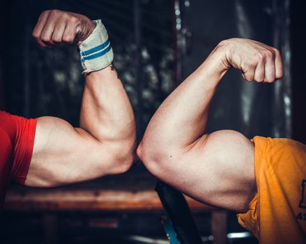 Male bodybuilder flexing his muscles