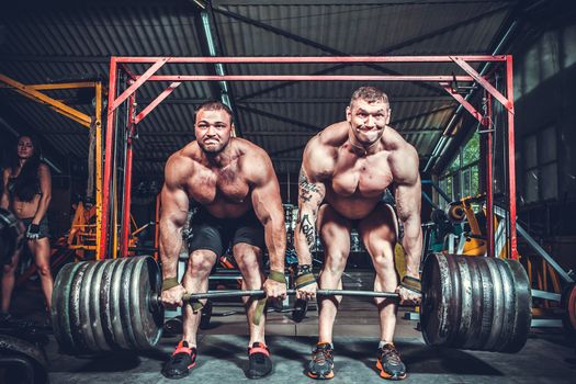 Powerlifter with strong arms lifting weights