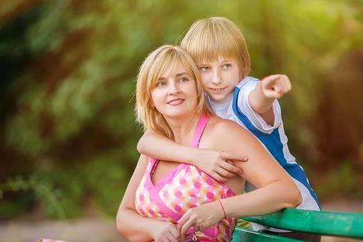 happy mother and son in park