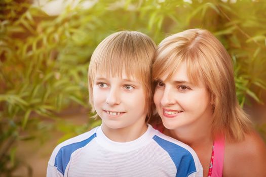 happy mother and son in park