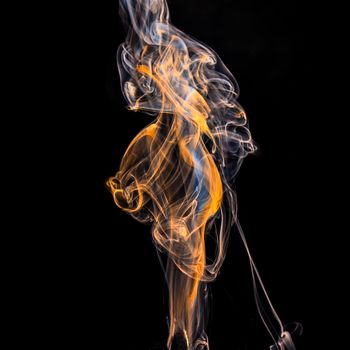 illuminated smoke that propagates on a black background