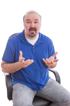 Close up Adult Guy with Beard and Mustache, Sitting on a Chair and Questioning Something Gesture While Looking at the Camera. Isolated on White Background.