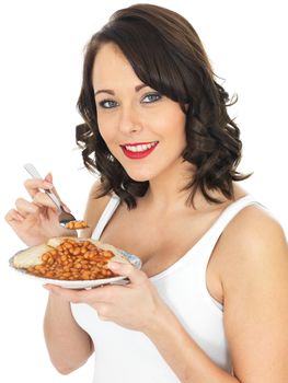 Healthy Young Woman Eating Baked Beans on Toast